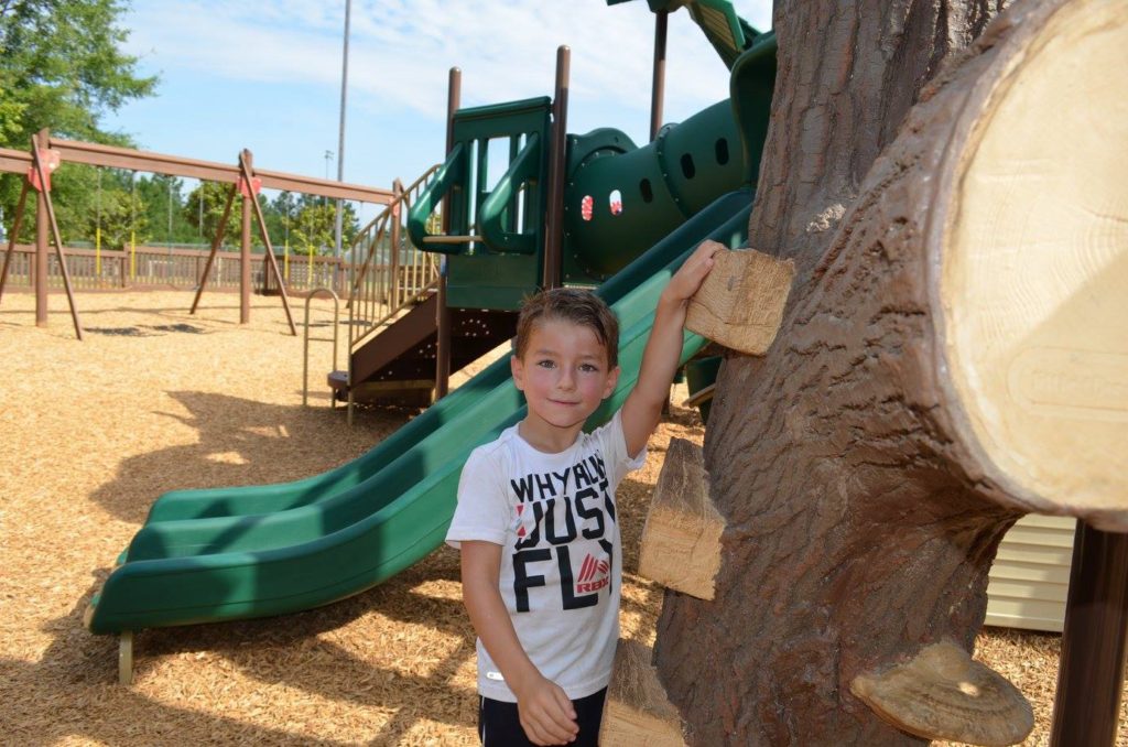 Young boy standing in the playground